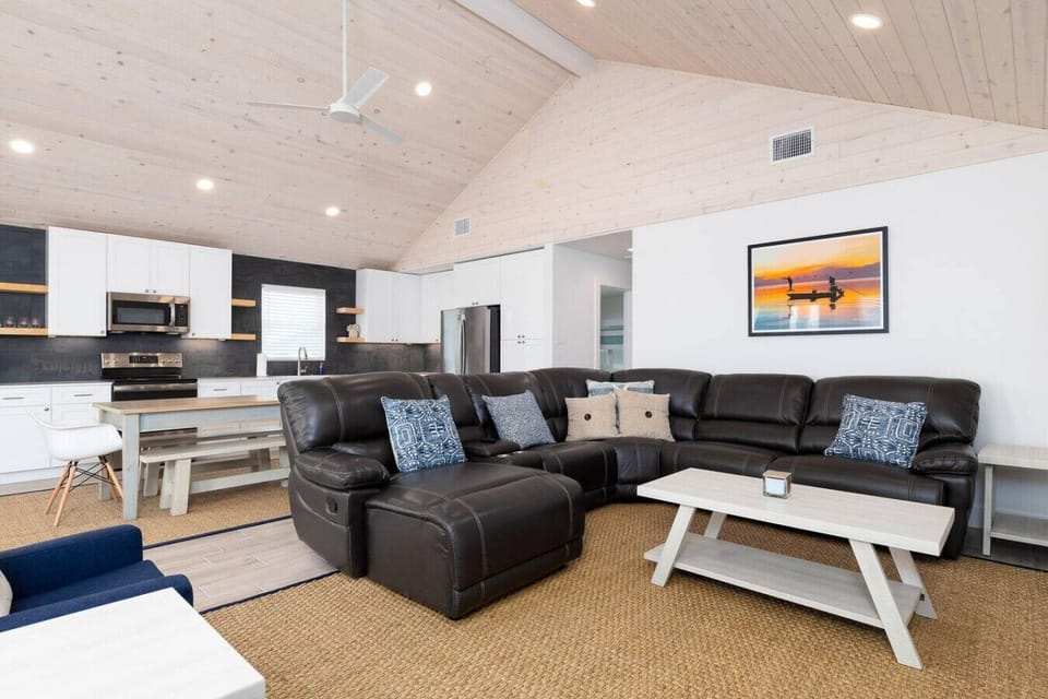 Bright, open-concept living room with plenty of space for the whole crew to relax together.