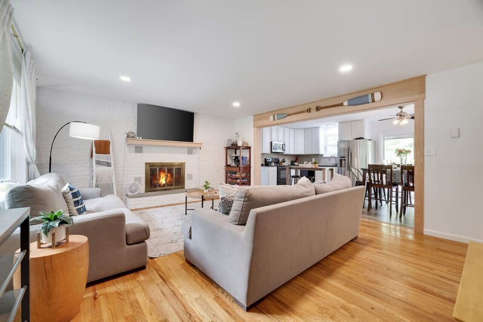 **Living Room** Our open-concept layout connects the living room seamlessly to the kitchen, creating a spacious and inviting atmosphere for entertaining and relaxing. Come and make lasting memories and feel right at home in our charming living space.