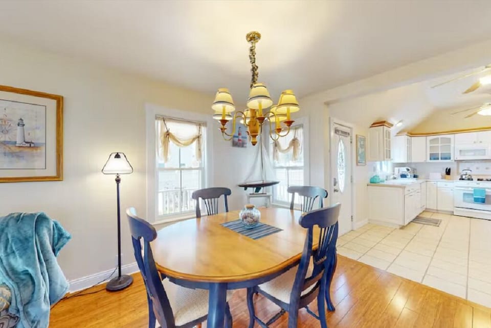 Dining room table has expandable leaf in downstairs cedar closet. Extra chairs.