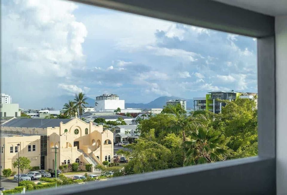 Take in elevated views across Cairns, where tropical greenery, city rooftops and distant mountain ranges create a scenic backdrop throughout the day.