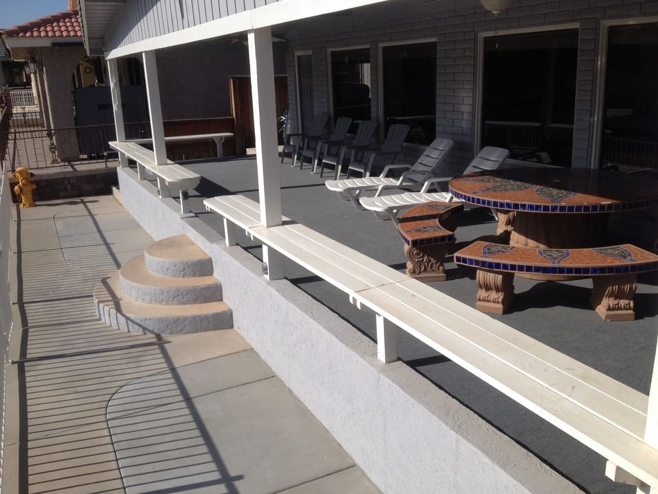 Family style outdoor dining table and plenty of seating.