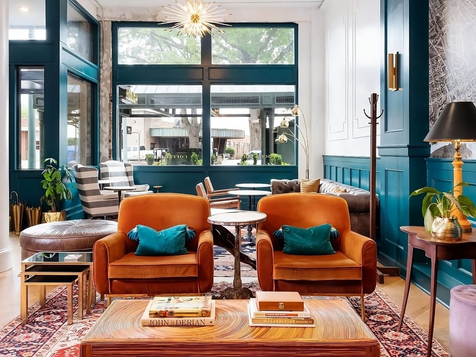 Sink into sunlit lounge seating and savor the boutique ambiance.