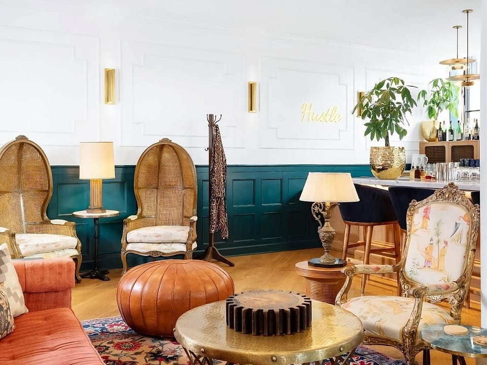 Sip and socialize in a playful lounge with vintage charm.