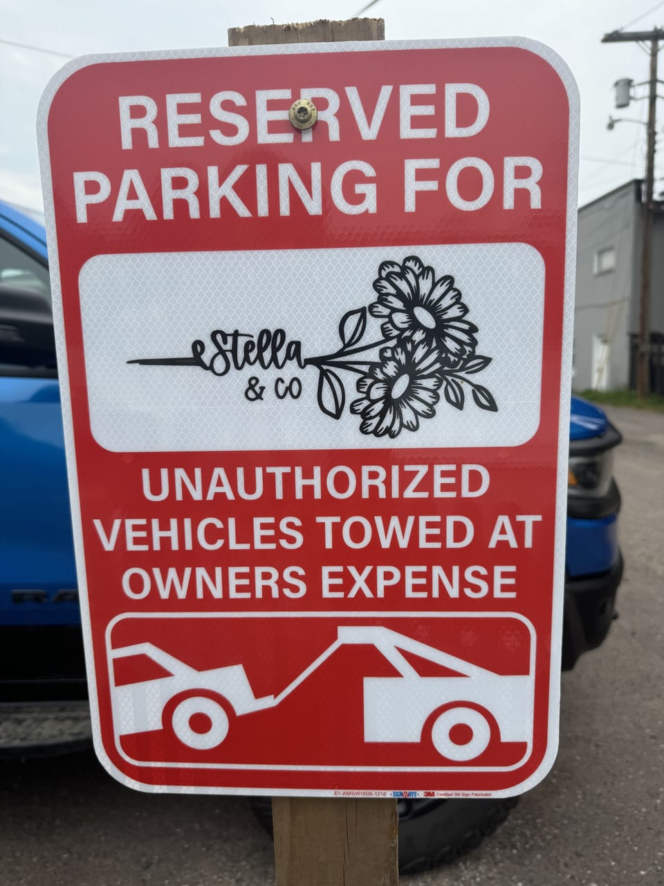 Parking Spot Reserved behind building in parking lot. Not in the driveway.