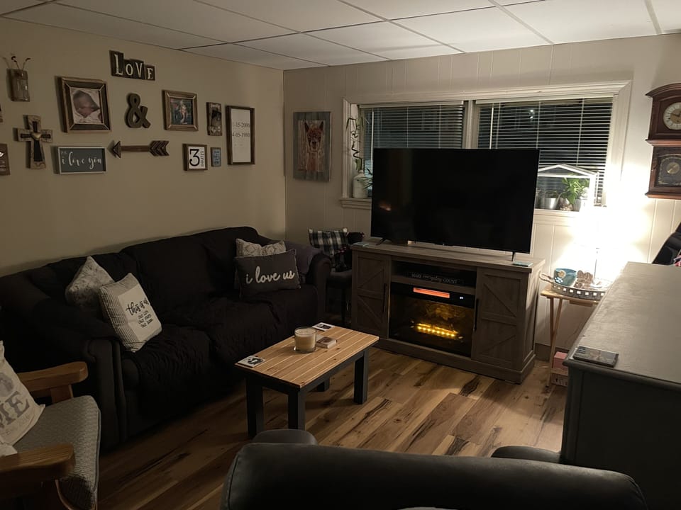 Living Room- Homey, Cozy, and Decorated with my family photos.