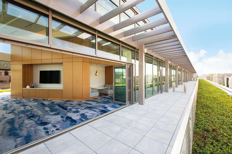 Step outside onto the bright rooftop terrace for fresh air.