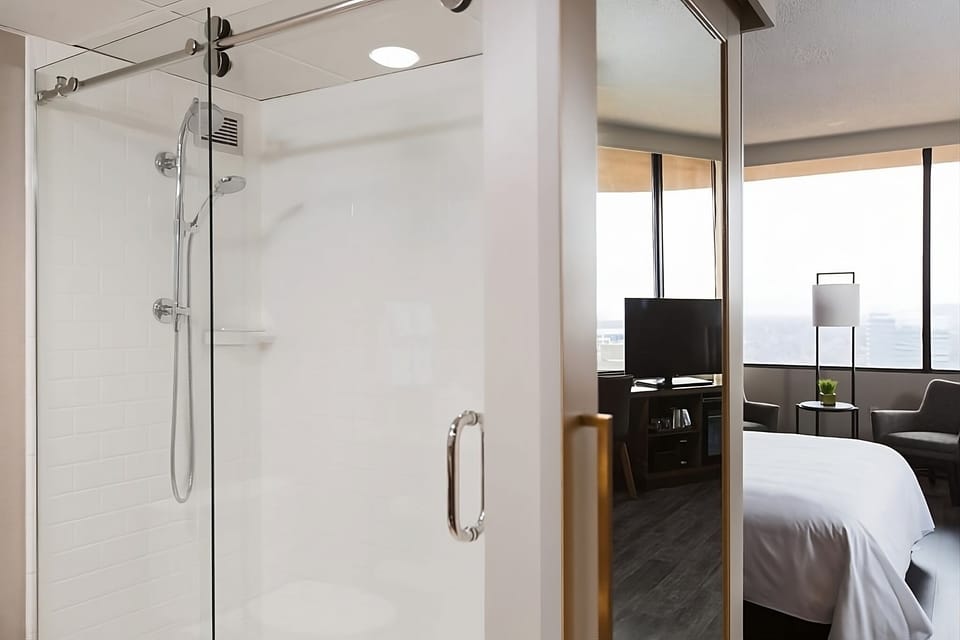 Refresh in a bright glass shower beside your room.