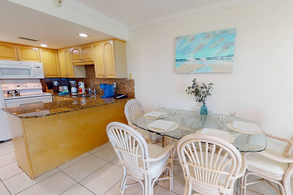 Dining Area for Four, with Additional Seating on the Balcony