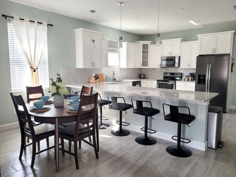 We also provide lots of bar seating at the kitchen island. This kitchen is perfect for hosting family gatherings!