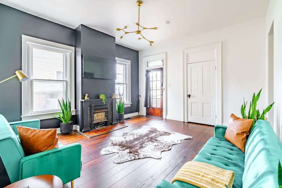 Spacious and Welcoming Living Room Our open living room offers ample seating and a clean, inviting atmosphere. Perfect for gatherings, the spacious area lets you relax in comfort and style with Superhost AirBnb