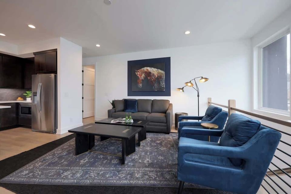 Unwind in this cozy sitting area while delicious meals are being prepared in the kitchen.
