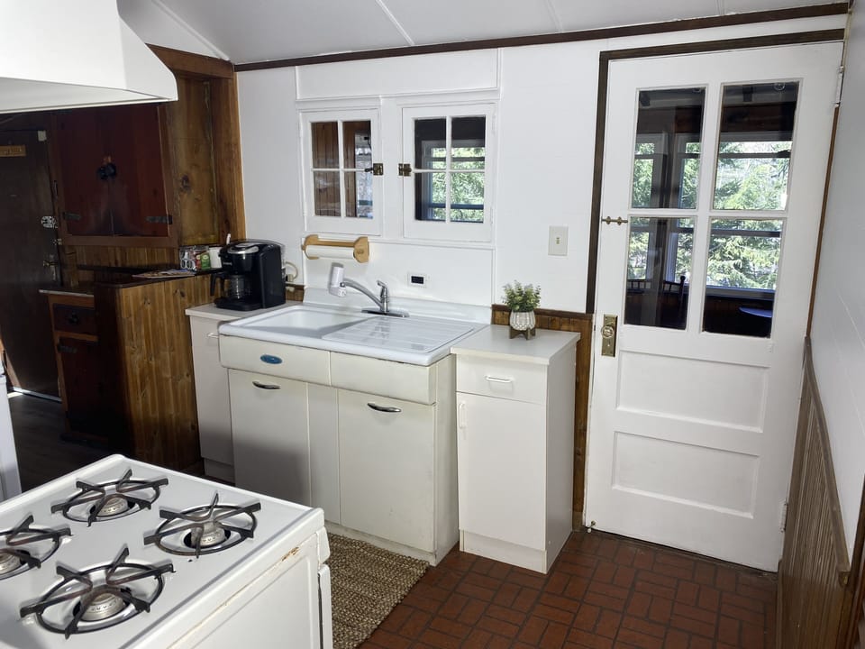 Fully stocked kitchen with Keurig Duo which takes pods and makes drip coffee.