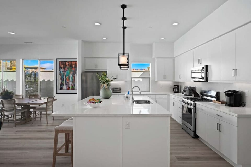Large kitchen island w/ seating, perfect for prepping meals or casual dining