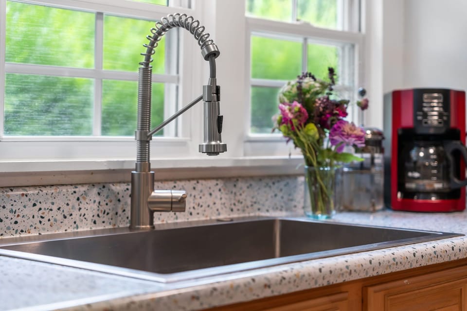 Crisp kitchen details that bring both style and convenience to your stay. 