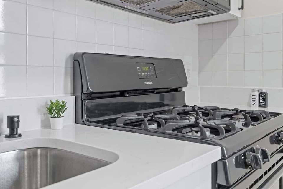 Fully equipped kitchen featuring modern appliances, cookware, a breakfast table for extra guests, and everything you need to prepare meals for your family or group.