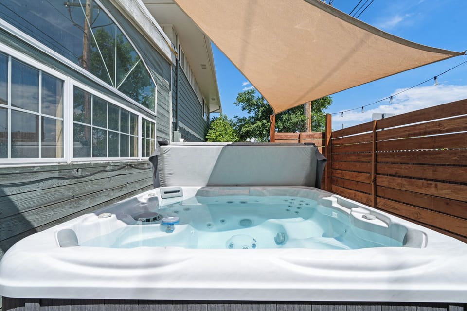 Hot tub + shade sail (seasonal).