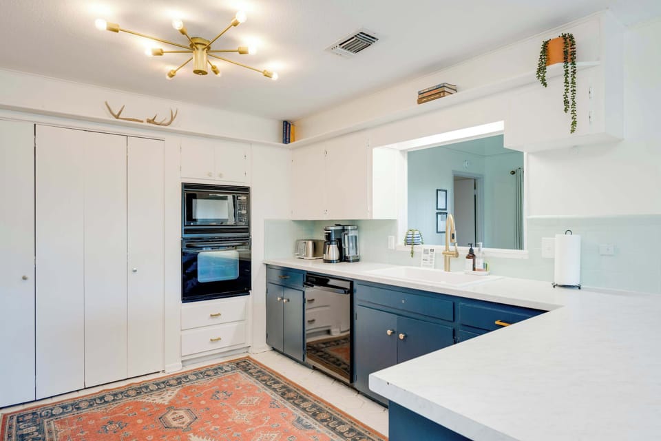 Kitchen with open concept to living and dining areas. Views of the lake from the sink!