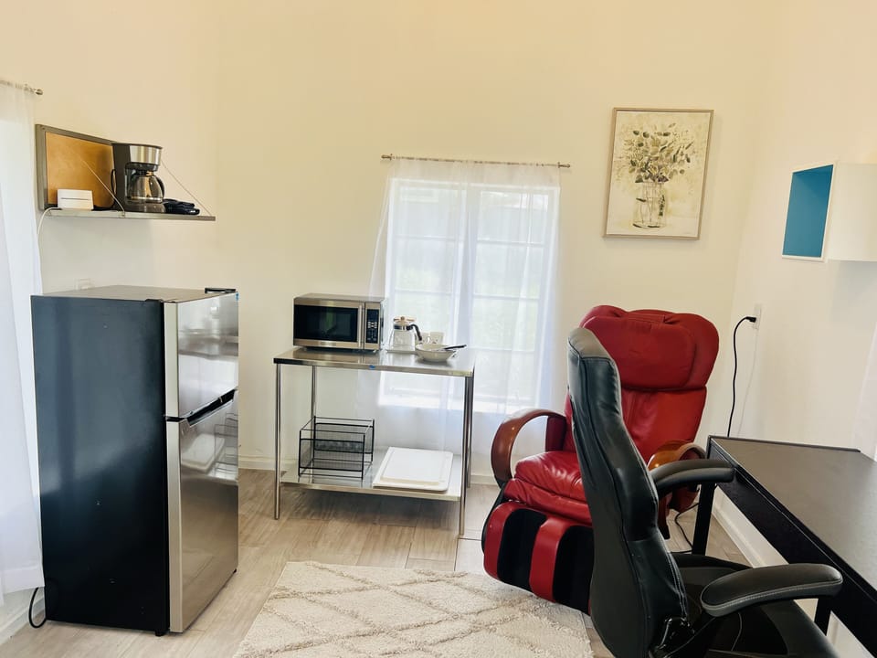 Write at the desk or relax in the red massage chair. 