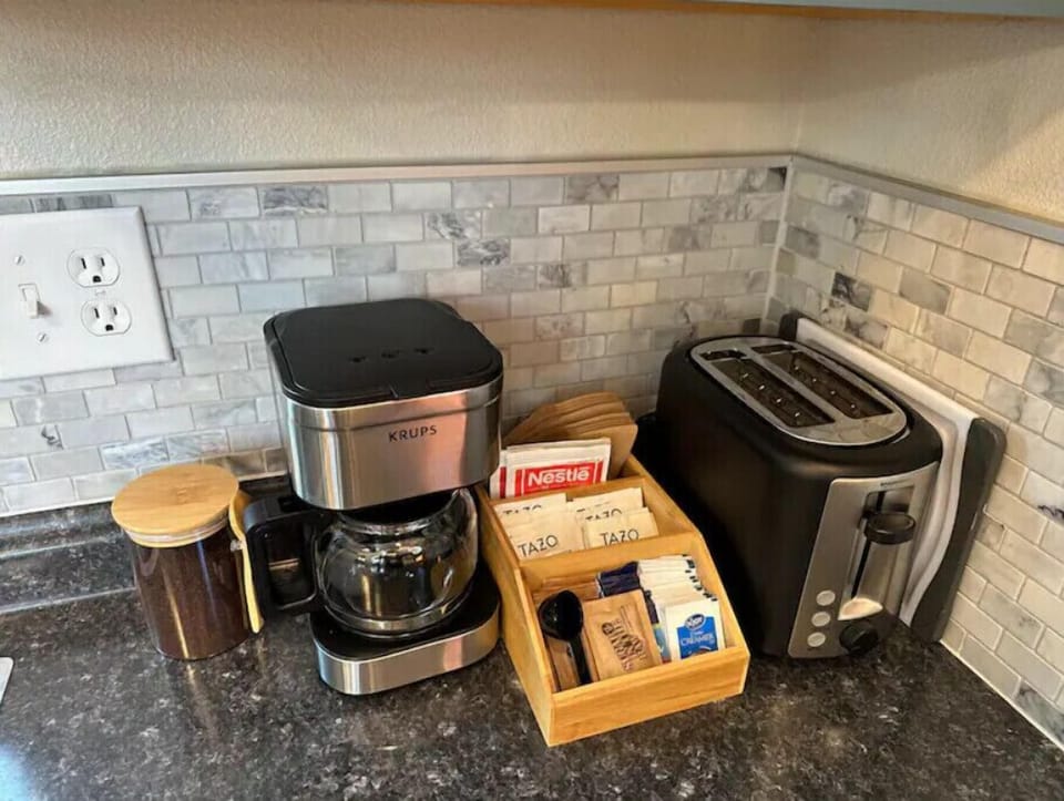 Electric coffee pot and toaster with condiments to start your day. Starbucks!