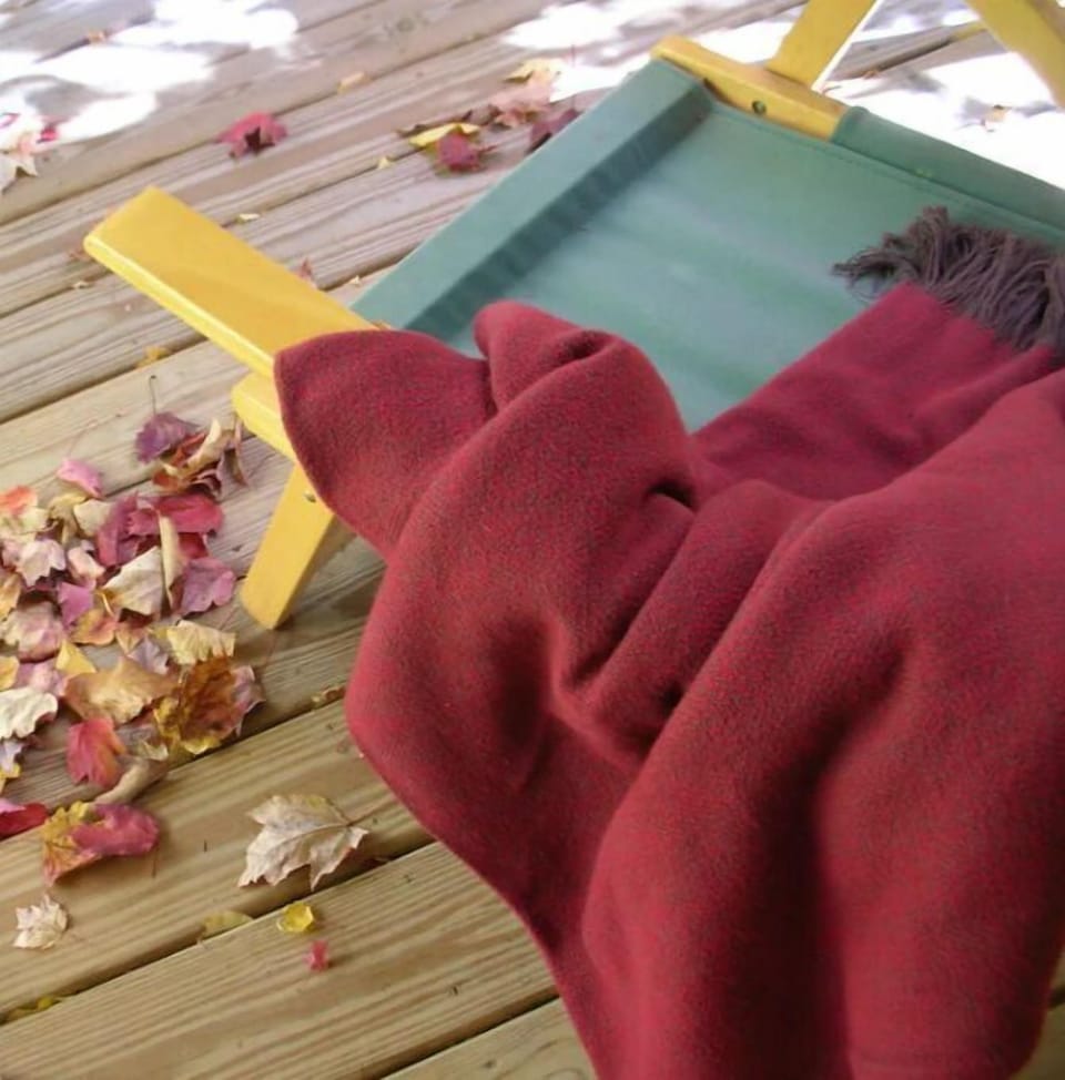 Relax on the porch with a blanket in the fall.