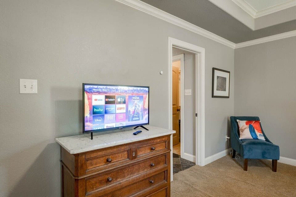 Cozy, yet large, Master bedroom with onsuite. Master bedroom has a dedicated work space desk, and a pac n play crib available for use. 42'' Smart Roku TV with YouTube TV provided, and many apps for you to log-in to.