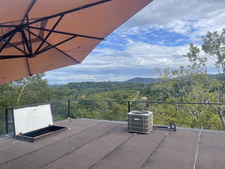 A/C unit and hatch to the roof looking east
