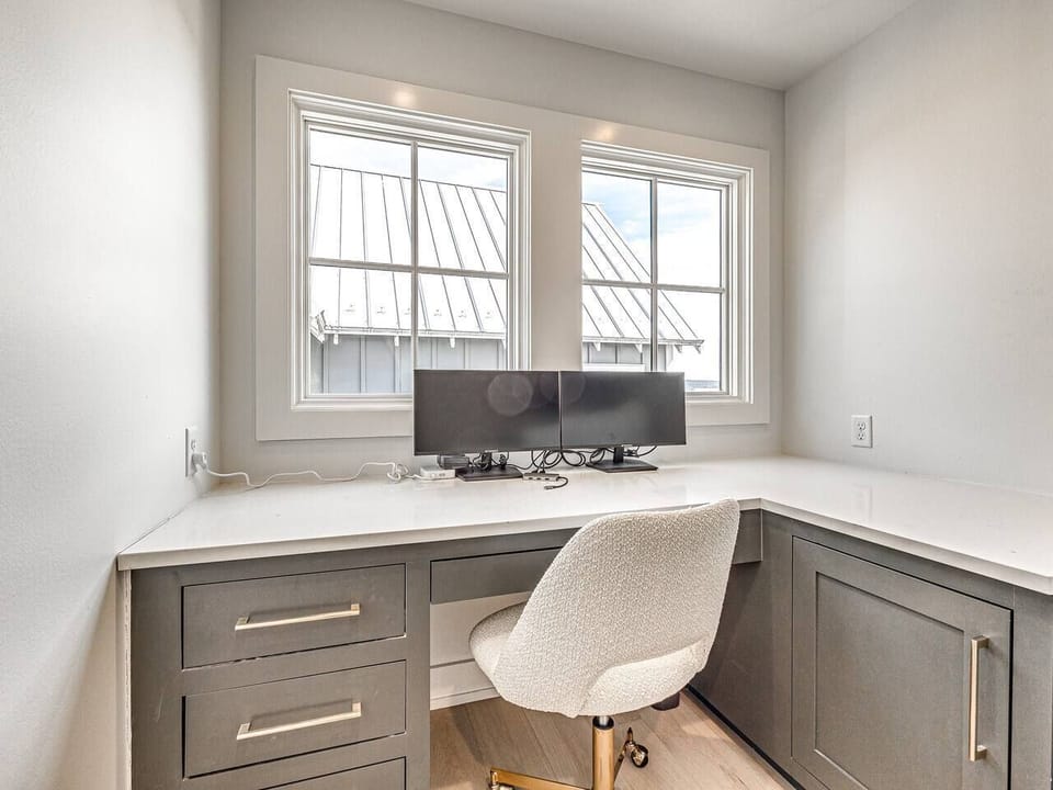Workspace with dual monitors and a multi-port connector. Ultra fast wireless internet throughout the home