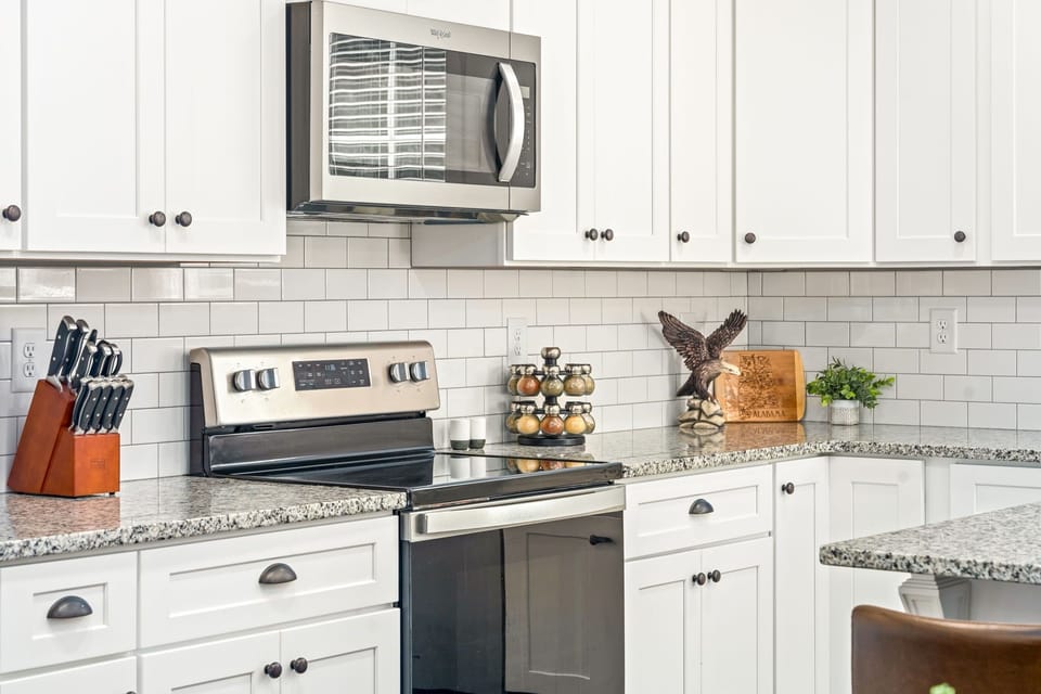 Fully stocked kitchen with spices, pots and pans, and small and large appliances