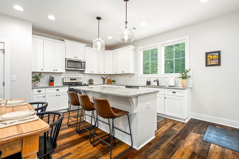 Large bar for food prep and seating for 3
