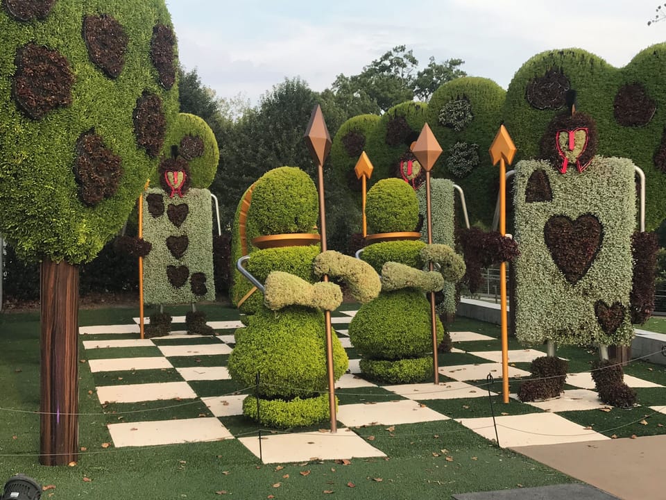 Discover playful topiary artistry for a magical outdoor photo moment.