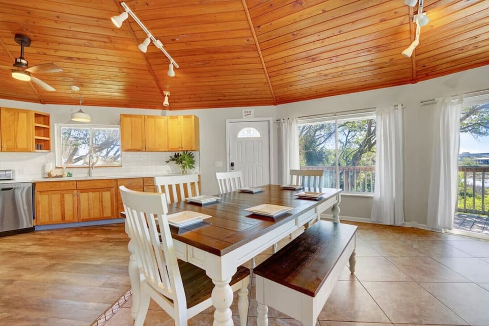 Experience culinary delights in a modern kitchen and dining space: where style and functionality converge for delightful meals and gatherings