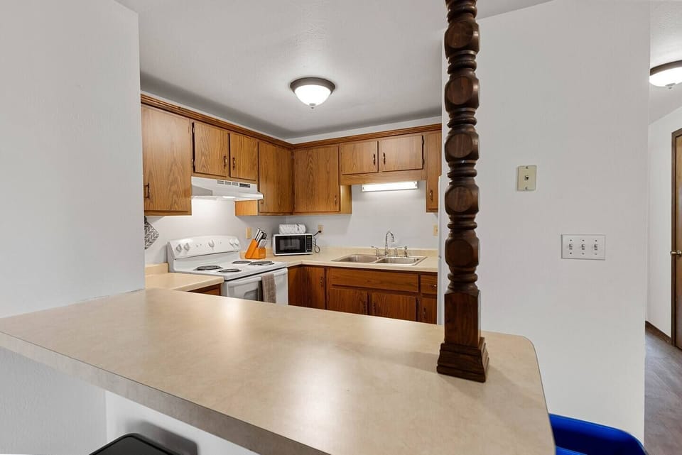 The kitchen is well stocked with all the cookware, gadgets, and appliances you could need. 