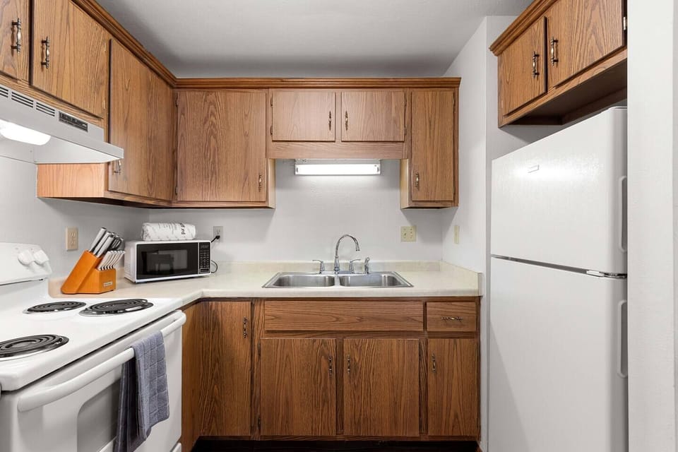 The kitchen is well stocked with all the cookware, gadgets, and appliances you could need. 