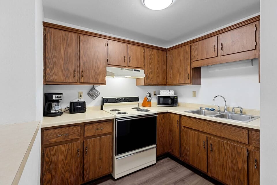 The kitchen well stocked with all the cookware, gadgets, and appliances you could need. 