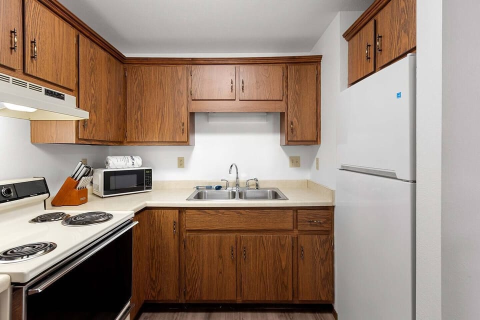 The kitchen well stocked with all the cookware, gadgets, and appliances you could need. 