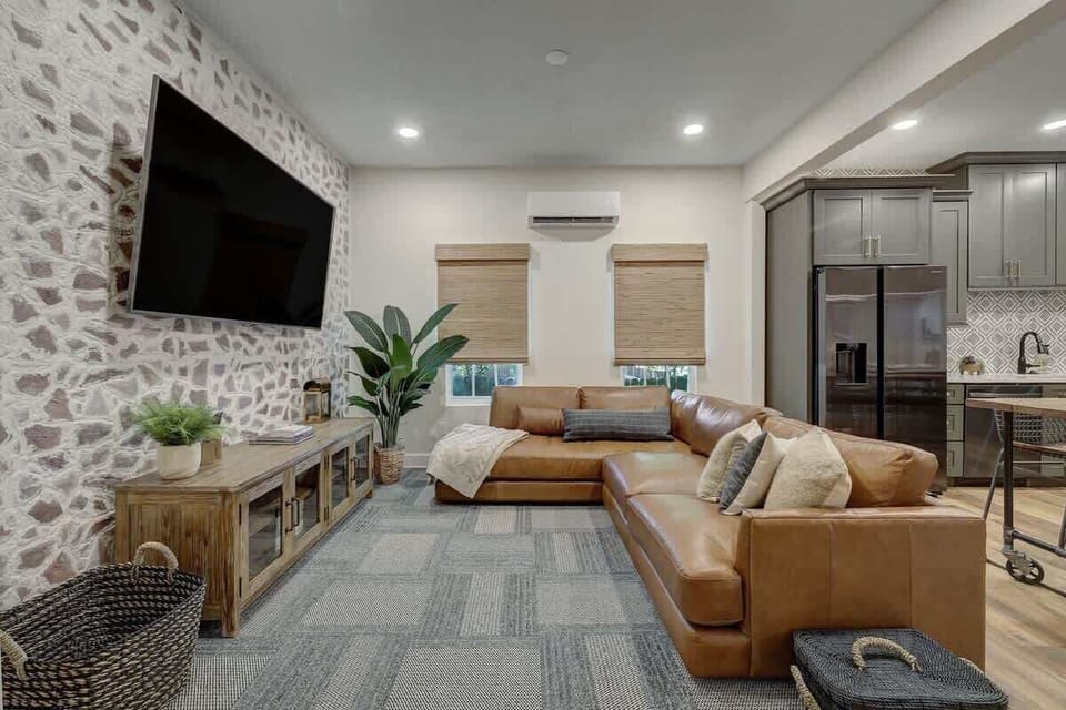 Large living room with plenty of comfortable seating for the whole group.  Enjoy your favorite shows on the large 75" TV!