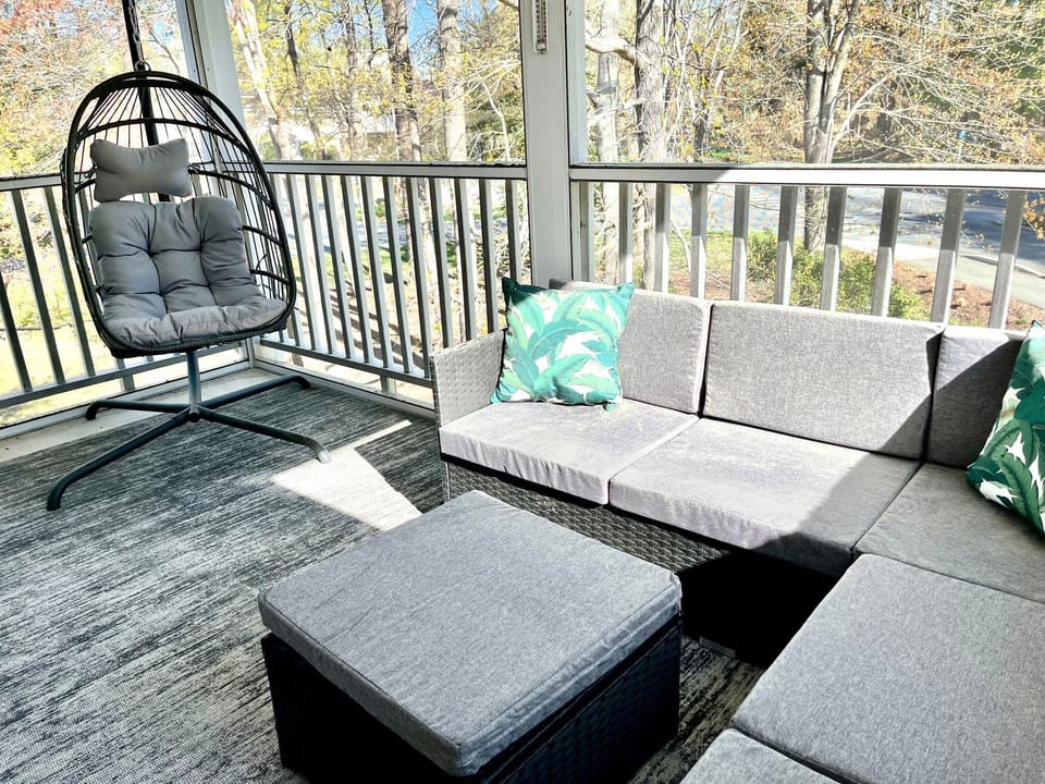 Indoor Patio- screened in porch, sectional couch, egg chair