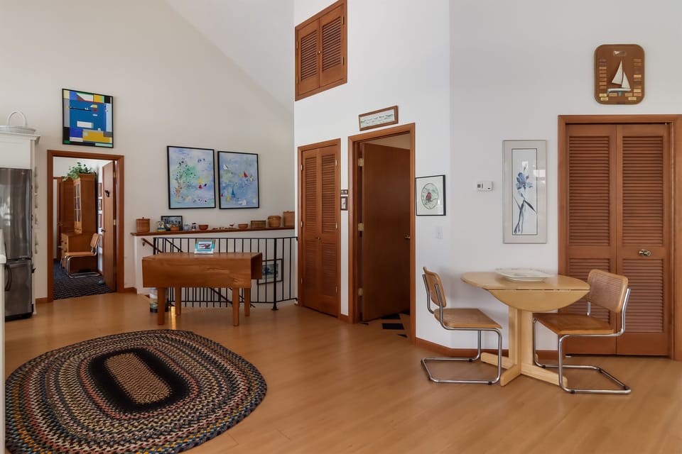 The half bath, located directly off the kitchen, has a nautical theme