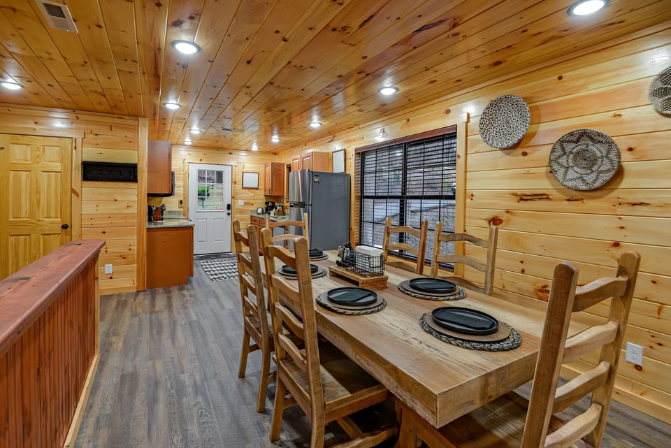 Large dining table with seating for six.