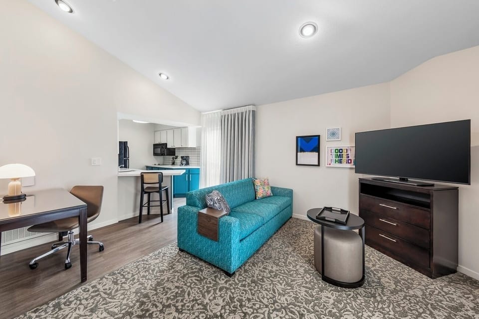 Stretch out in the spacious lounge with dedicated work desk.