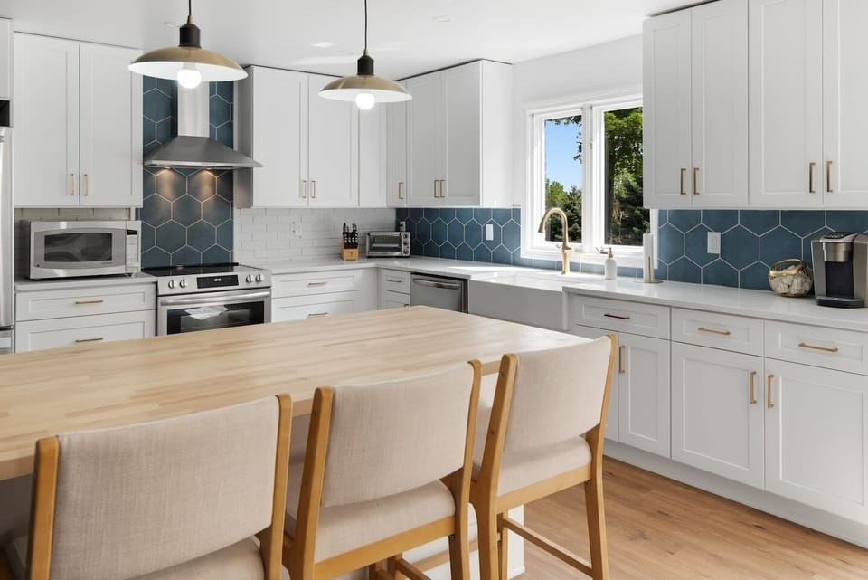 The spacious island provides space to gather and share memories while making a home away from home cooked meal.