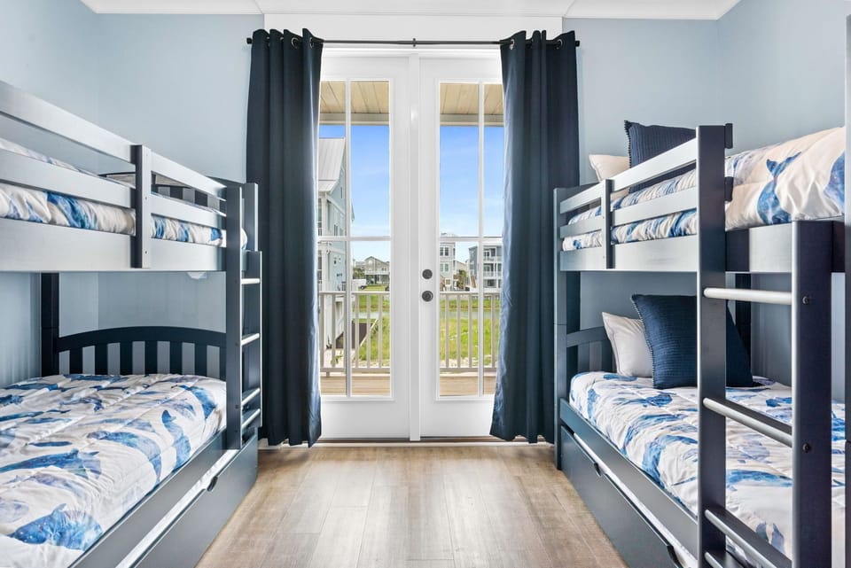 First floor kids bedroom with bunk beds and trundle beds 