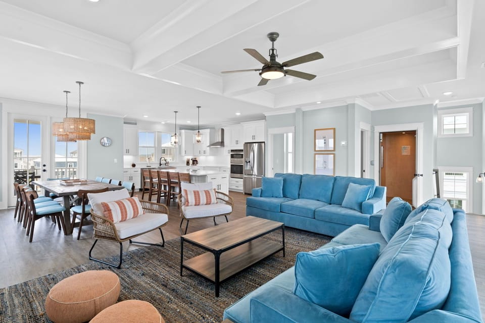 Large living space with plenty of seating and a reverse floor plan for views