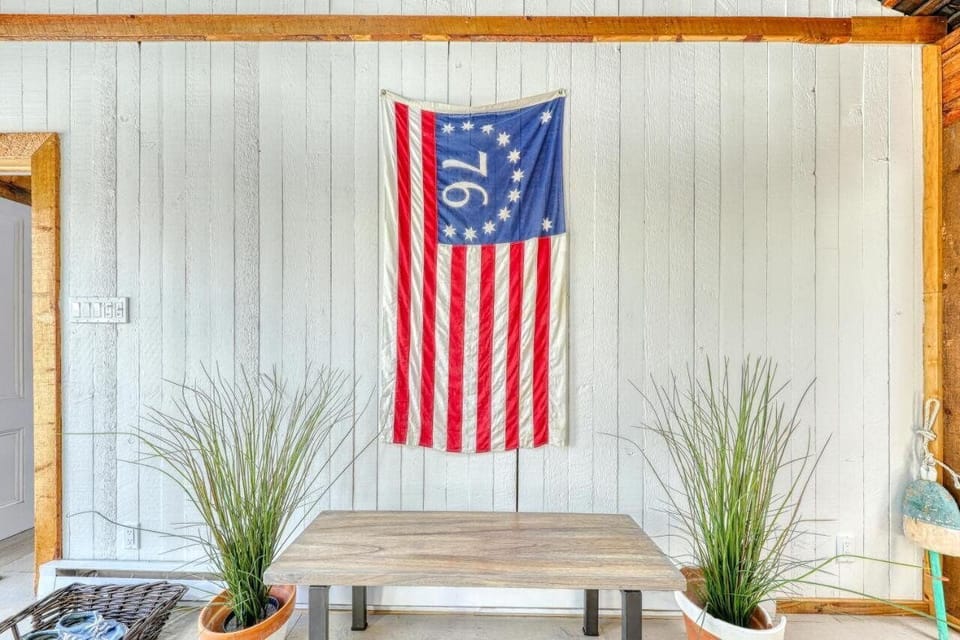 A bi-centennial celebration flag hangs in the living area.