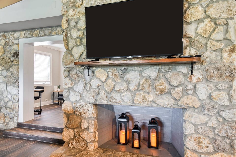 The large TV is visible from all areas of the room.