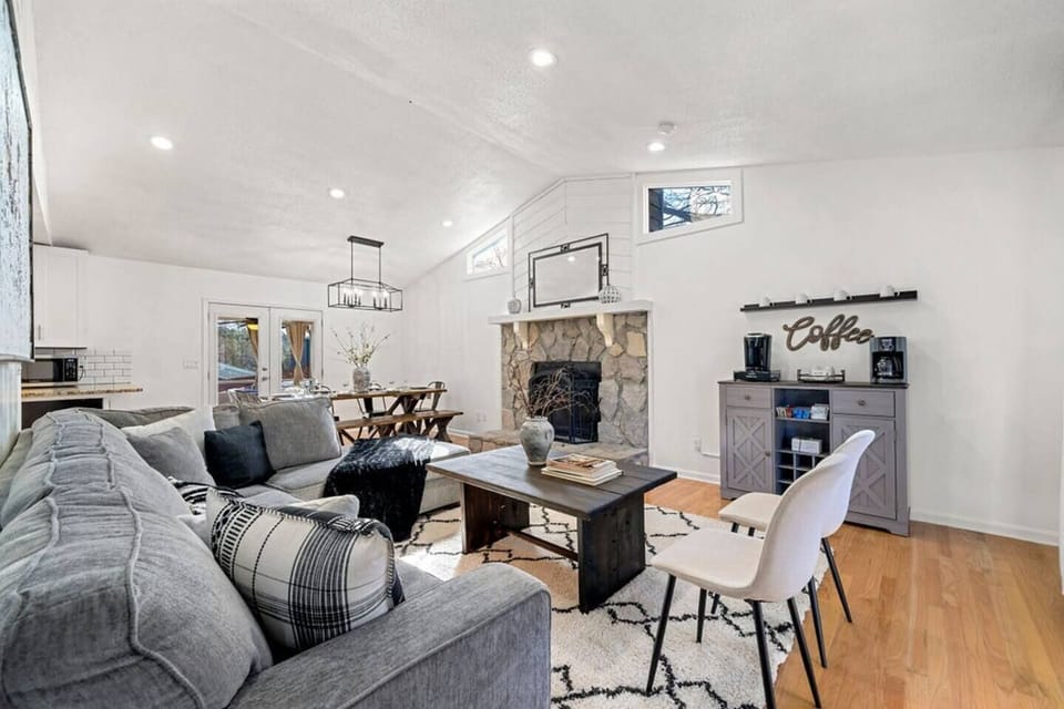 The long living room feels immersive. Gathering the group is easy with the open plan kitchen, dining, and living areas and walk-out deck with additional dining area.