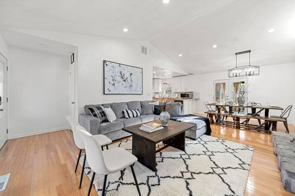 Step into a world of spacious comfort! Our open concept design and soaring high ceilings create an airy atmosphere that invites you to unwind. Sink into our cozy living room, featuring a plush sofa that transforms into a dreamy Queen size bed.