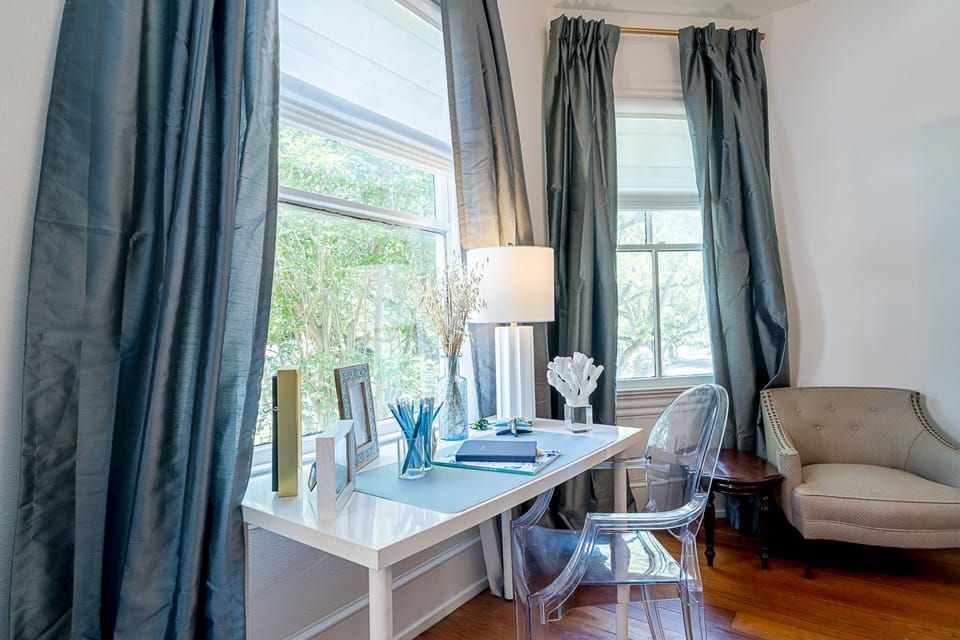 Stare at the tree lined street at this workspace if you MUST work on vacation
