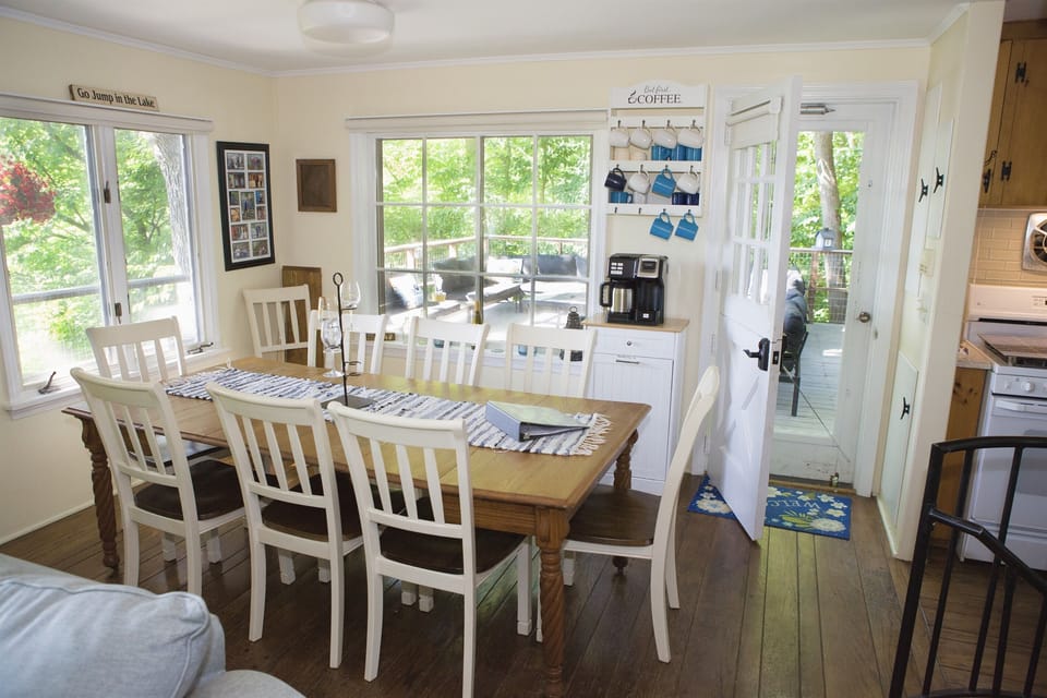 The bright, spacious dining area can fit  at least 10 and has leaves and extra chairs.