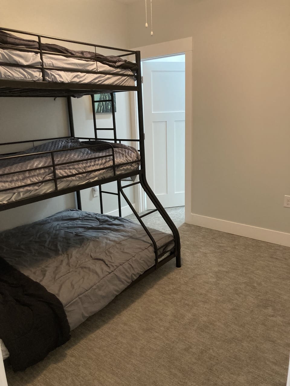 Bedroom 2: Triple bunk bed (1 full and 2 twins)